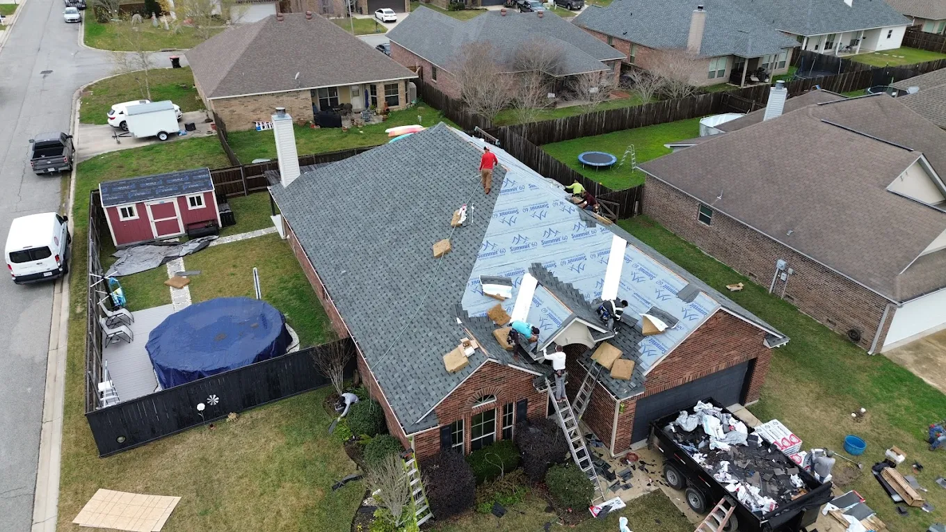 Colorwheel Roofing team installing shingles on a residential property